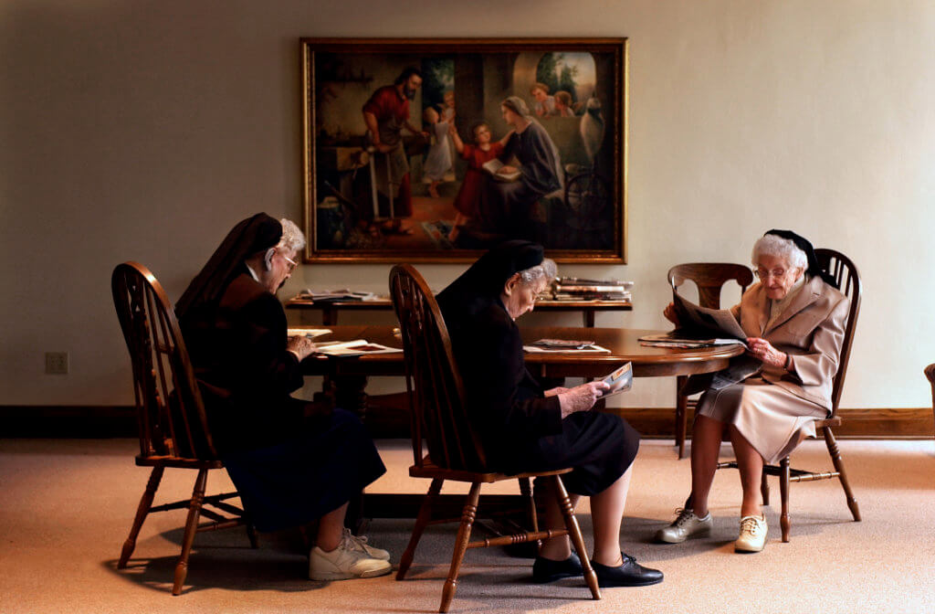 (L-R) The Nun Study subjects Sisters Alcantara, 91, Claverine, 87, and Nicolette, 94, reading in the Community Room in at the School Sisters of Notre Dame convent